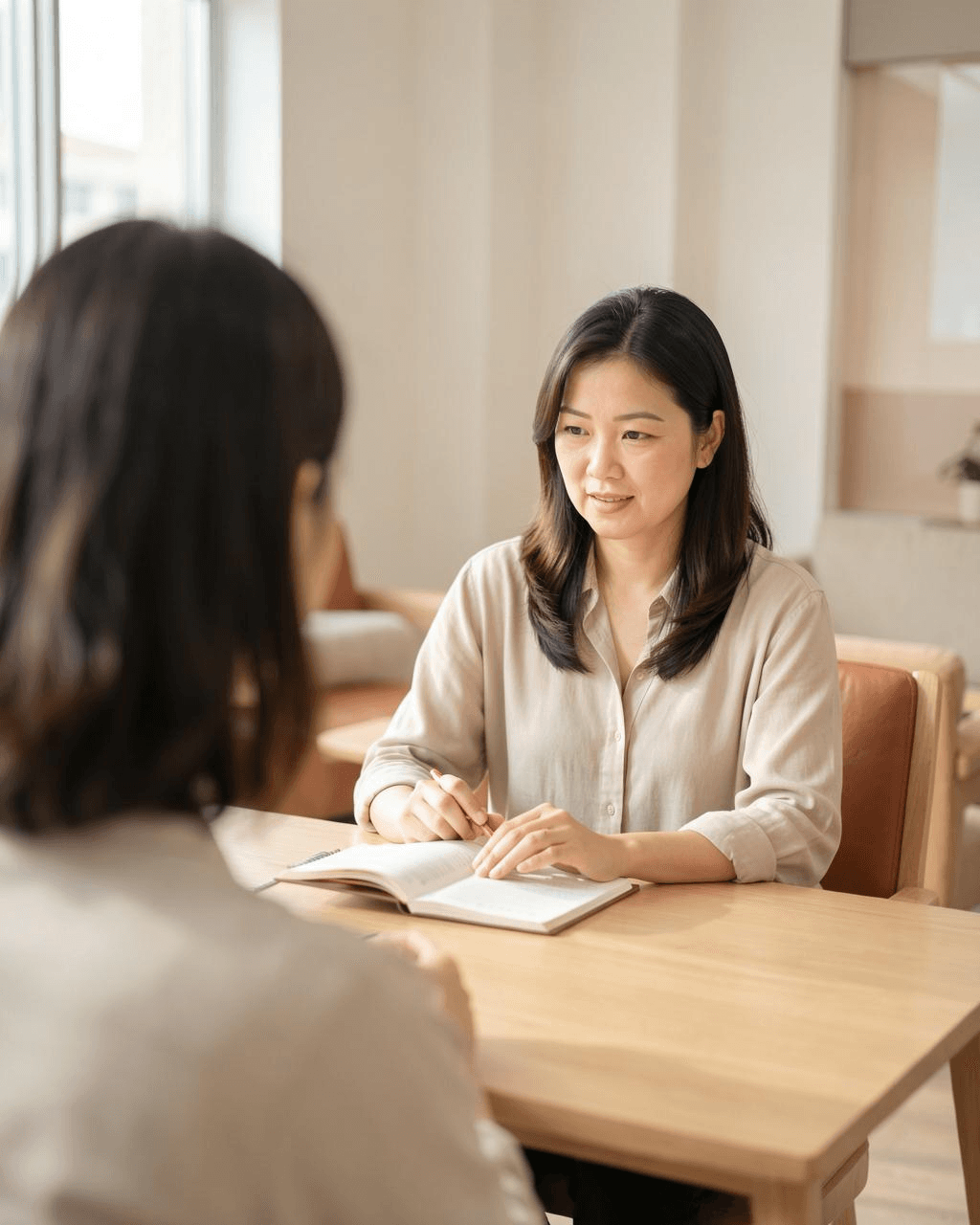 Advisor talking with a client across a table